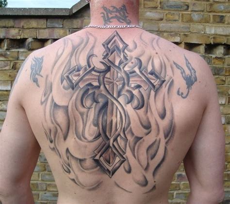 Tribal style cross tattoo on back - Tattooimages.biz