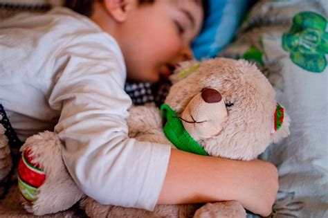 Cute kid sleeping with Teddy bear - Free Stock Photo Download - 1471