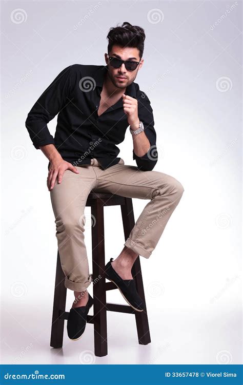 Young Man Posing On A High Chair Royalty Free Stock Photos - Image ...