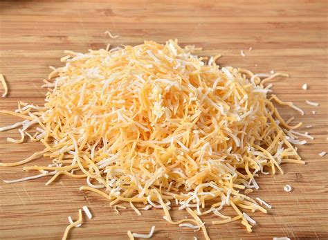 That bag of shredded cheese may seem convenient, but it’s destroying your recipes by causing ...