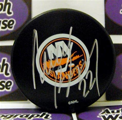 Mike Bossy autographed hockey puck (New York Islanders NHL SC2) AW Certificate of Authenticity ...