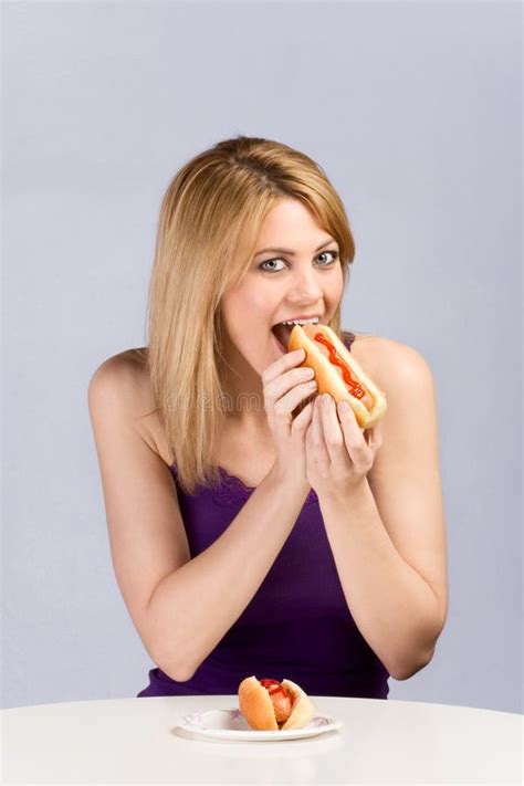 Young Blond Woman Eating Hot Dog With Ketchup Stock Photo - Image of bread, fast: 8840940