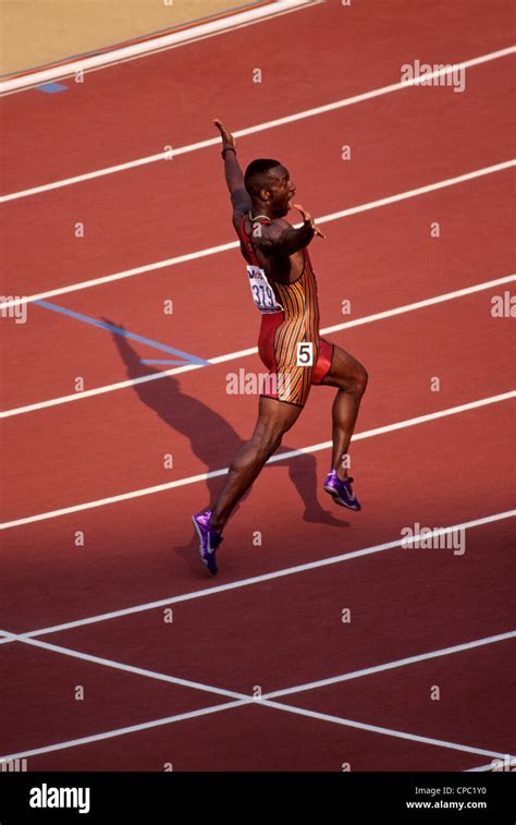 Michael Johnson winning the 200 meters in a world record time of 19.66 ...