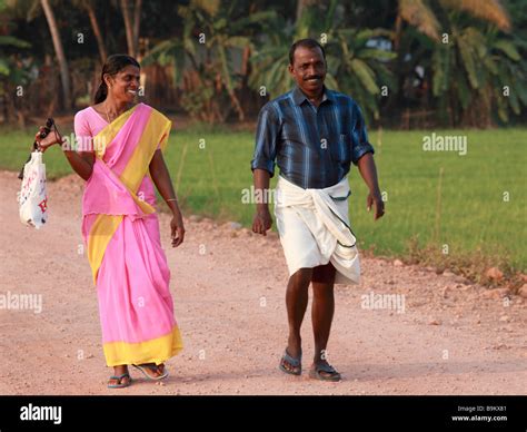 India Kerala Backwaters couple on a country road Stock Photo - Alamy