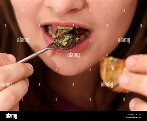 Eating Snails Escargot de Bourgogne Stock Photo - Alamy