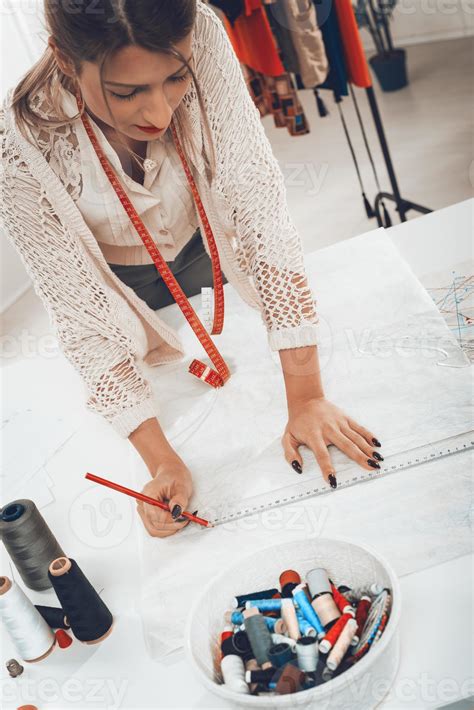 Woman Tailor With Sewing Pattern 14064339 Stock Photo at Vecteezy