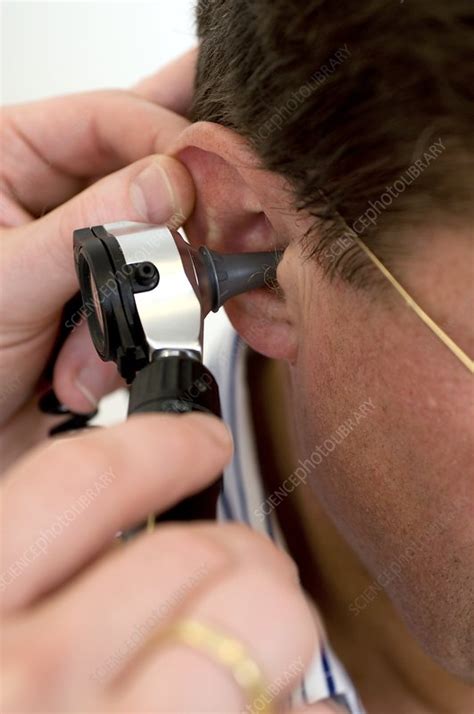 Ear examination - Stock Image - C002/1450 - Science Photo Library