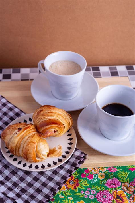cup of coffee and croissant 10978013 Stock Photo at Vecteezy