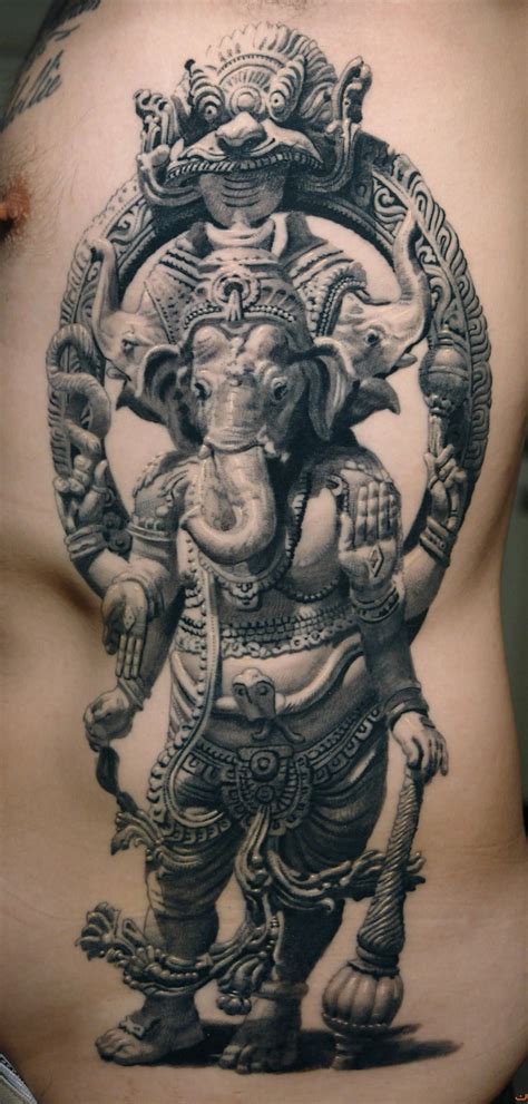 an elephant tattoo on the back of a man's stomach