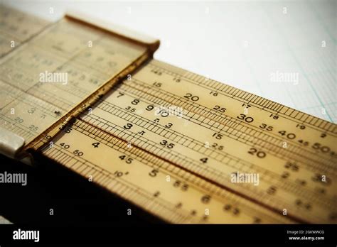 Logarithmic slide rule on piece of graph paper Stock Photo - Alamy