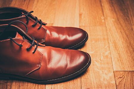 Royalty-Free photo: Closeup photo of man wearing brown leather shoes and blue jeans | PickPik