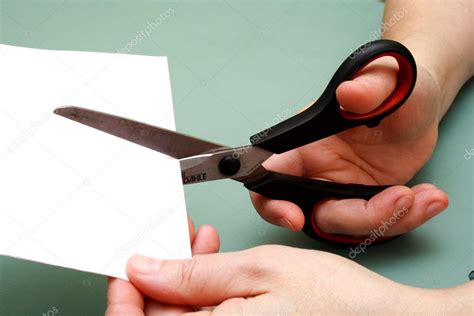 Women hand cutting paper with scissors — Stock Photo © redwine2001 #5421063