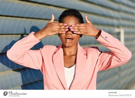 Black woman covering her eyes with her hands. - a Royalty Free Stock ...