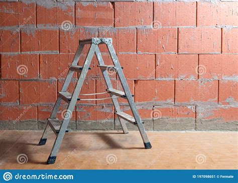 Small Step Ladder In Front Of A Raw Brick Wall From Porotherm Style Clay Blocks In An Unfinished ...