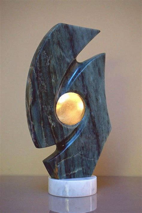 Green abstract sculpture soapstone with solid gold This green abstract sculpture contain solid ...