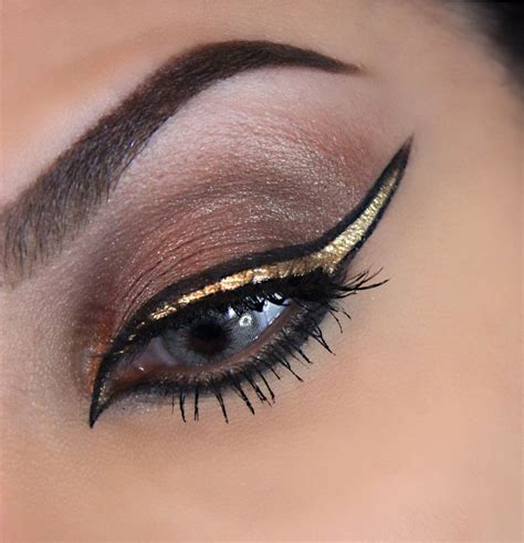 Pharaonic eye makeup #goldeyeliner #wingliner #eyeliner #gold #brown # ...