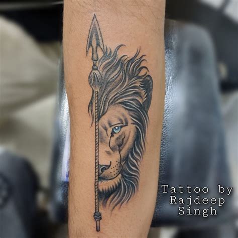 Lion Tattoo with Arrow Design