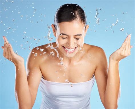 Water Splash, Skincare and Woman Isolated on Blue Background for Beauty, Cosmetics Cleaning and ...