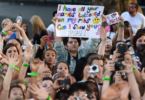 And then things start to get a bit weird. | One direction concert, One direction, Concert signs