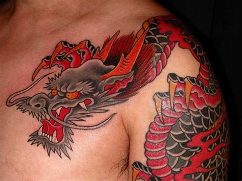 Traditional Japanese Dragon Tattoo On Man Left Shoulder And Chest
