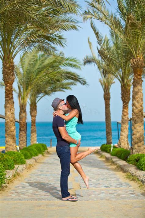 Couple Kissing In Romantic Embrace On Beach Stock Image - Image of ...