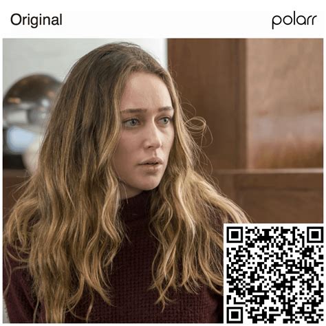 a woman with long hair and a qr code on her face is looking at the camera