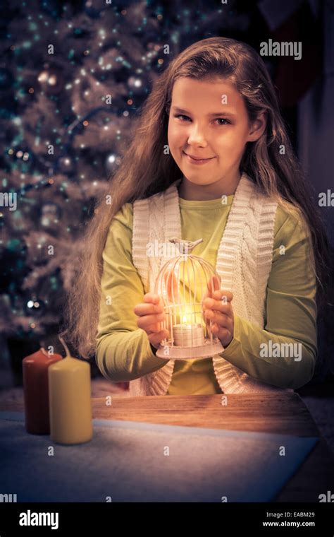 a teenage girl with christmas lights at home Stock Photo - Alamy