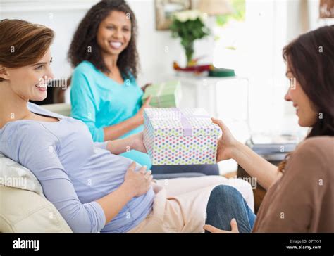 Pregnant woman having baby shower Stock Photo - Alamy