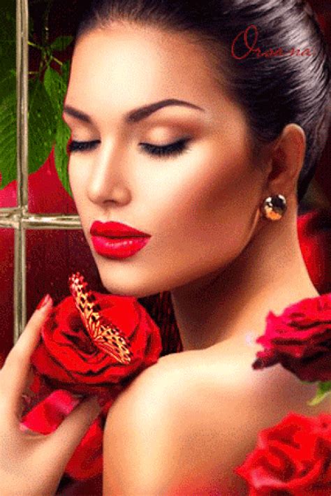 a woman with red lipstick holding a rose