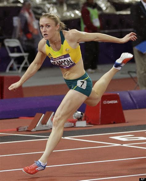 Australia's Sally Pearson reacts as she crosses the finish line to win ...