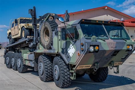 retrowar — An M1075 palletized load system truck carries an...