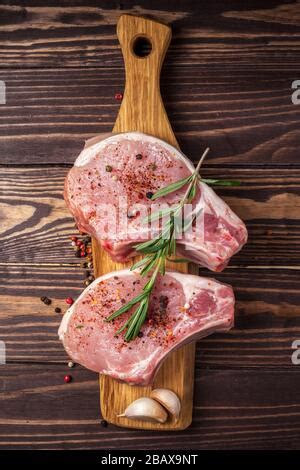 fresh raw meat with rosemary on black slate, on dark background, steak Ribeye Stock Photo - Alamy