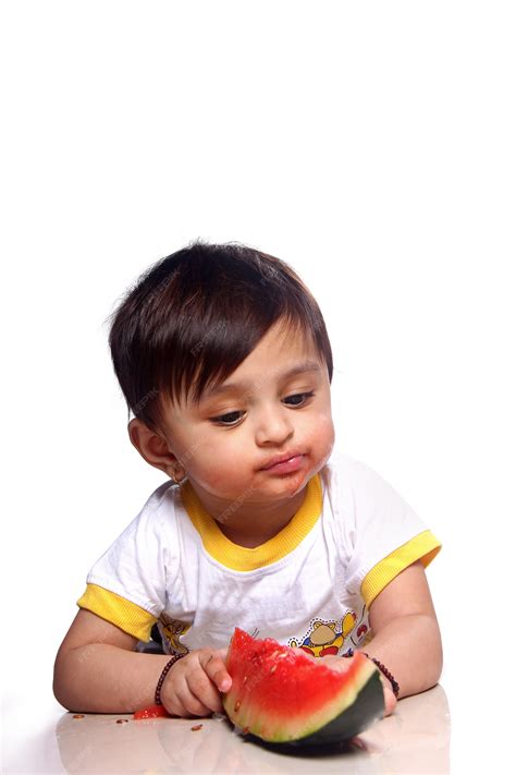 Premium Photo | Child eating watermelon