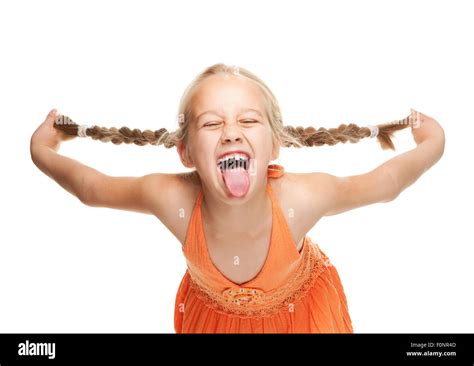 Little girl making funny face Stock Photo - Alamy