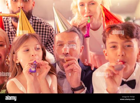 Children feeling excited while celebrating birthday with family Stock ...