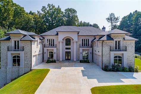 Exquisite new construction gated estate situated on one acre lot in Sandy Springs. Picturesque ...