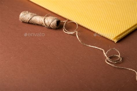 Beeswax honeycomb sheet on brown background Stock Photo by molenira