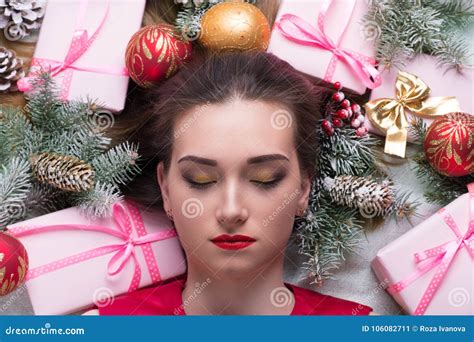 The Young Woman is Surrounded with Christmas Tree Decorations an Stock Image - Image of ...