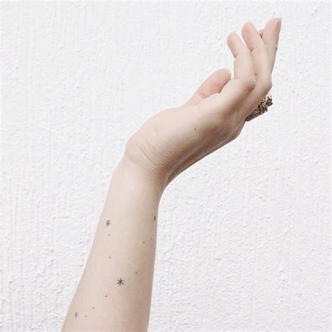 Tiny star tattoos by Stanislava Pinchuk - Tattoogrid.net