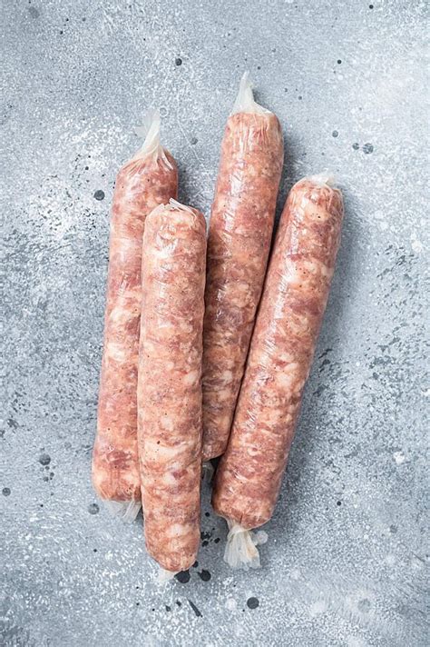 Top View Of Raw Bratwurst Sausages On A Gray Kitchen Table Photo Background And Picture For Free ...