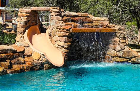 Swimming Pool Rock Slides Photos│ Blue Haven Pools | Swimming pool landscaping, Pool waterfall ...