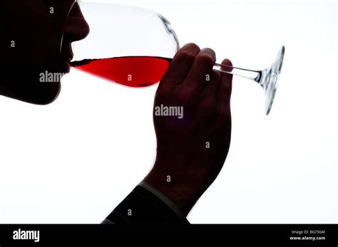 man sipping red wine form wine glass Stock Photo - Alamy