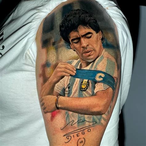 Realistic Maradona portrait tattoo located on the upper