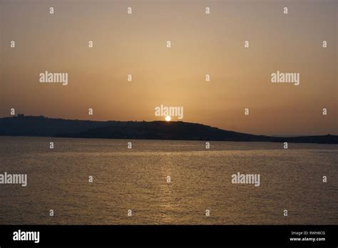 Beach time, sunset in Malta, Malta Island Stock Photo - Alamy