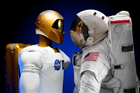 Astronaut And Robonaut Shake Hands Free Stock Photo - Public Domain Pictures