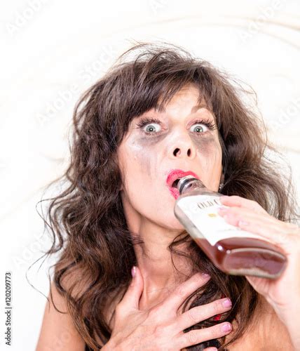 Drunk Woman with Whiskey Bottle in Bedroom Stock Photo | Adobe Stock