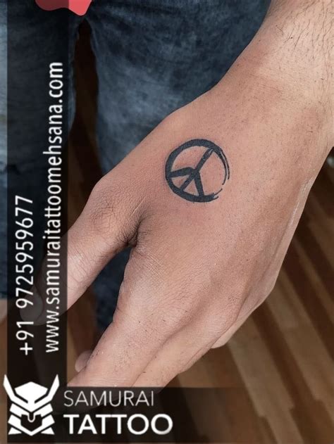 Hand Peace Sign Tattoo