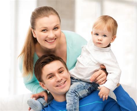 Premium Photo | Picture of happy parents playing with adorable baby