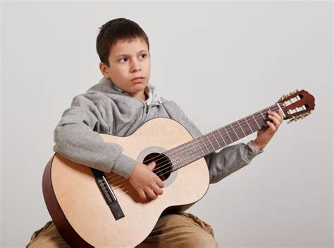 Boy is Playing the Acoustic Guitar on White Background Stock Photo - Image of person, portrait ...