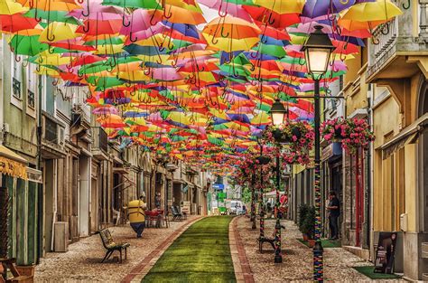 ♥ Águeda, Portugal - The "Umbrella Sky Project" began in 2011 as a part of the Portuguese city's ...